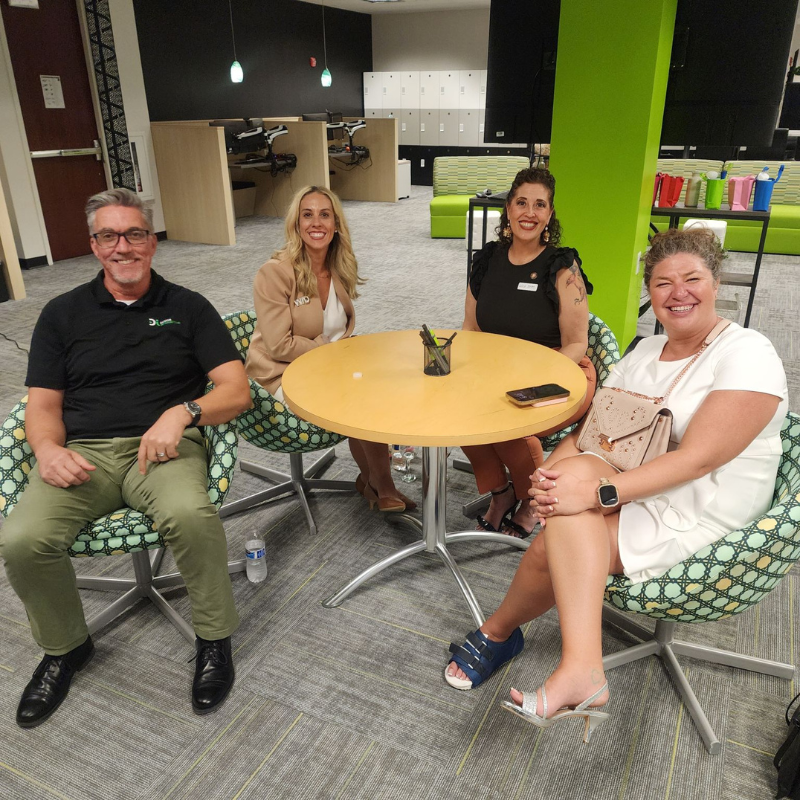 WID Central Florida members smile at a networking event.